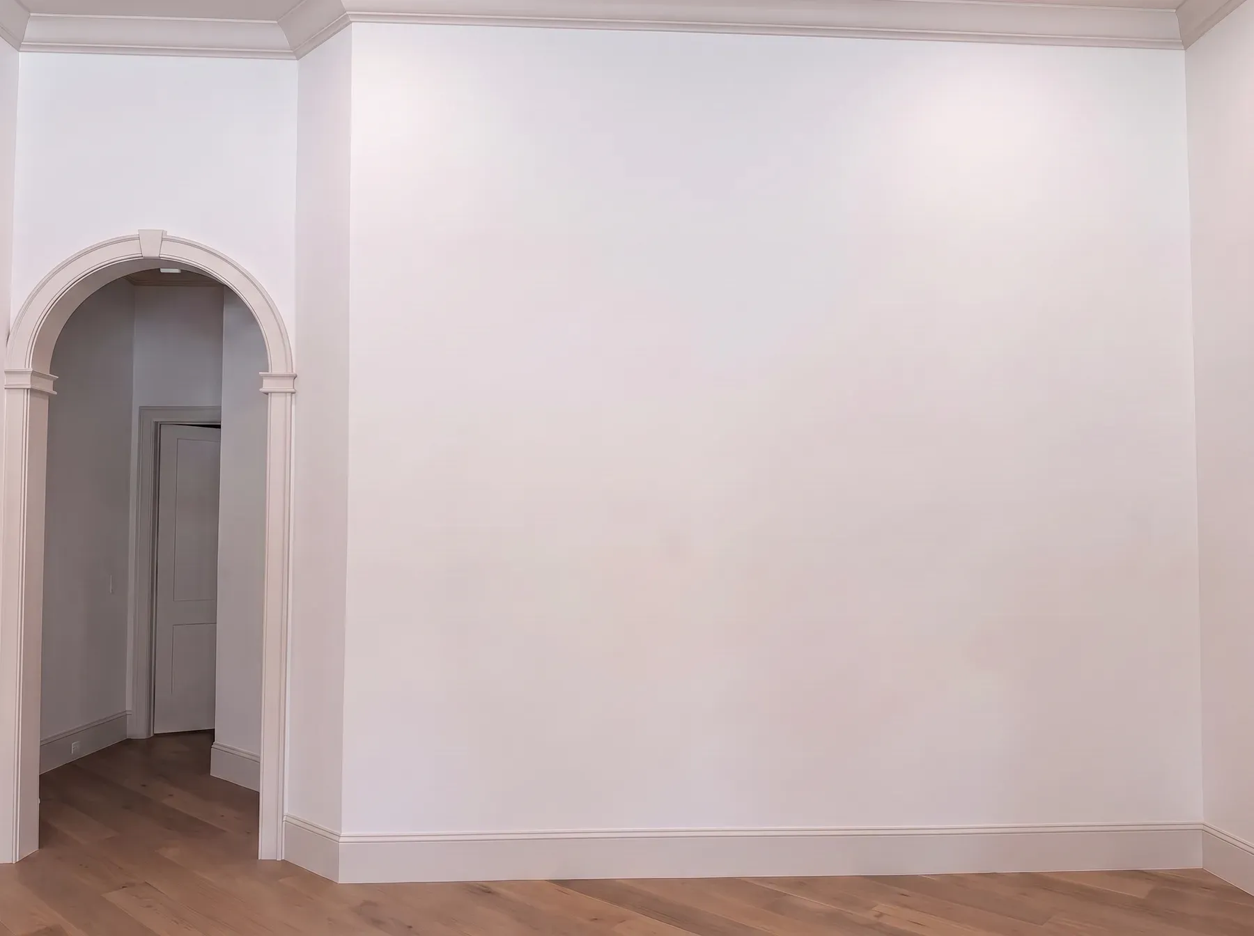 Stone Chimney & Arched Built-Ins before the installation: the original blank wall